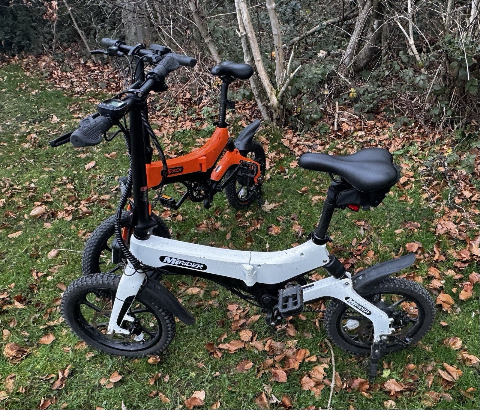MiRider One Folding Electric Bikes Orange And White Pair.