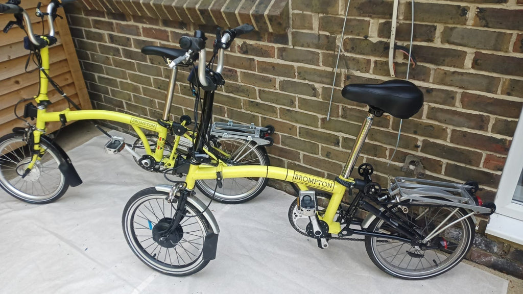 A Pair of Yellow Bromton Bikes In Excellent Condition with Conversion Kit
