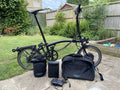 Brompton E-Folding Bike 6-Speed with Rear Rack And Large City Bag