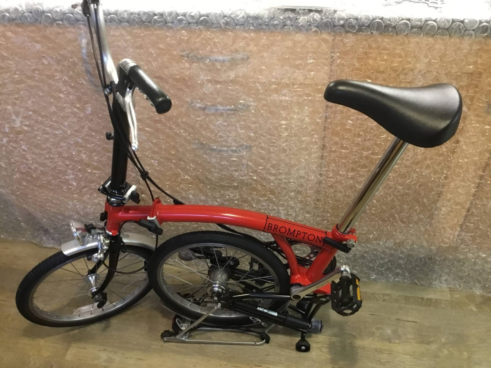 Brompton Folding Bike Red with Reflectors and Mudguards.