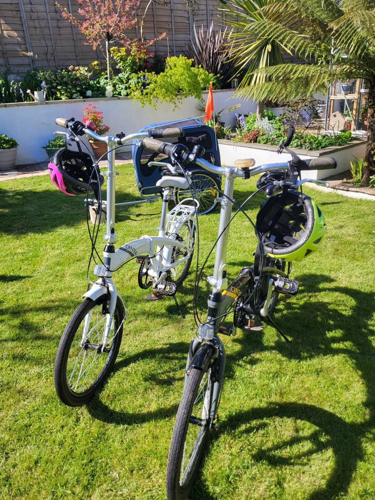 Compass Central  20in Folding Bicycles X  2, one white, one black.