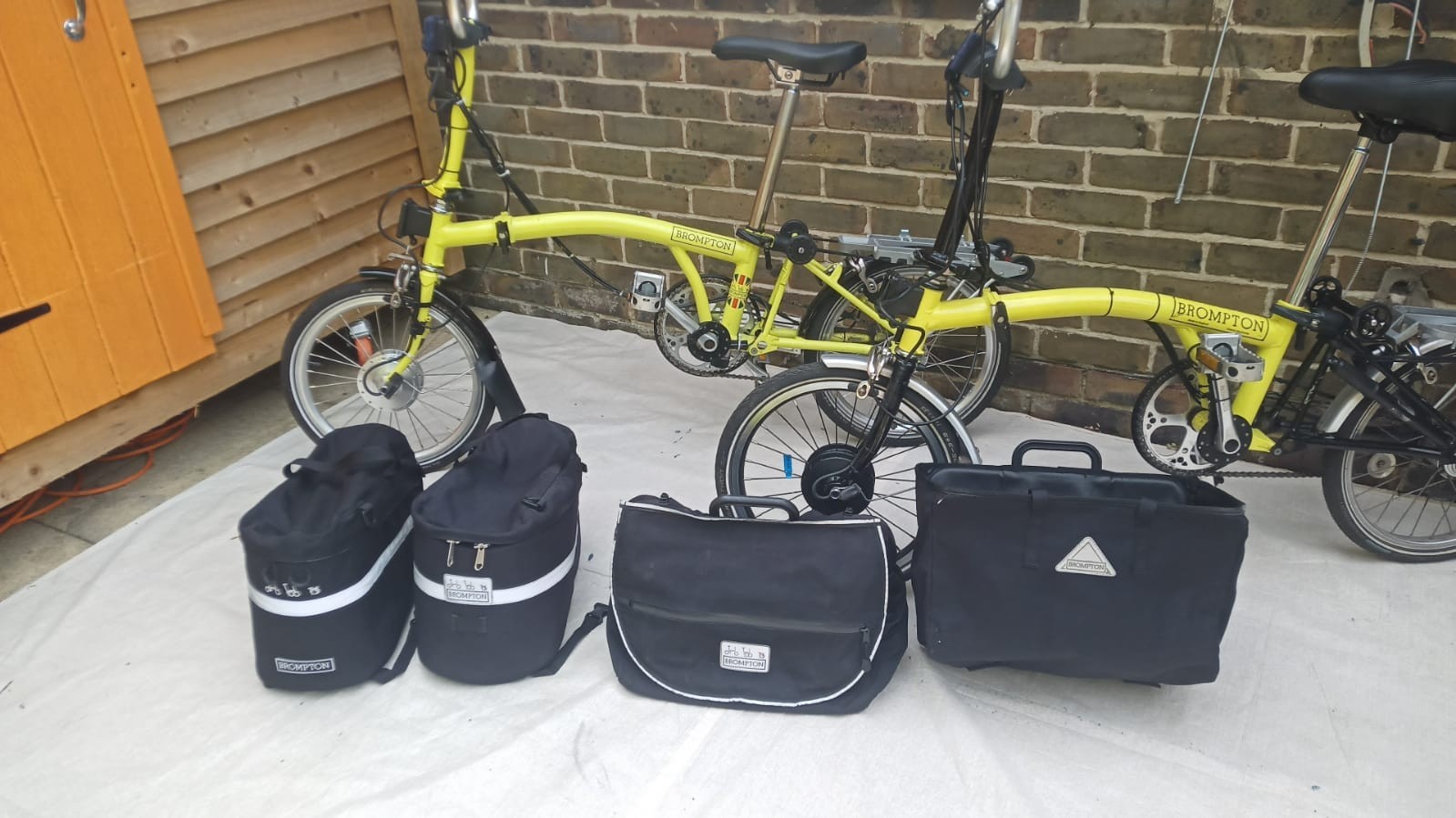 A Pair of Yellow Bromton Bikes In Excellent Condition with Conversion Kit
