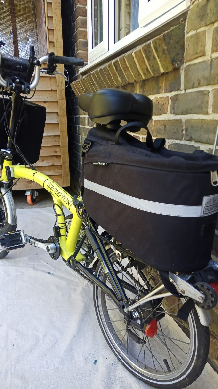A Pair Of Canary Yellow Bromton Bikes