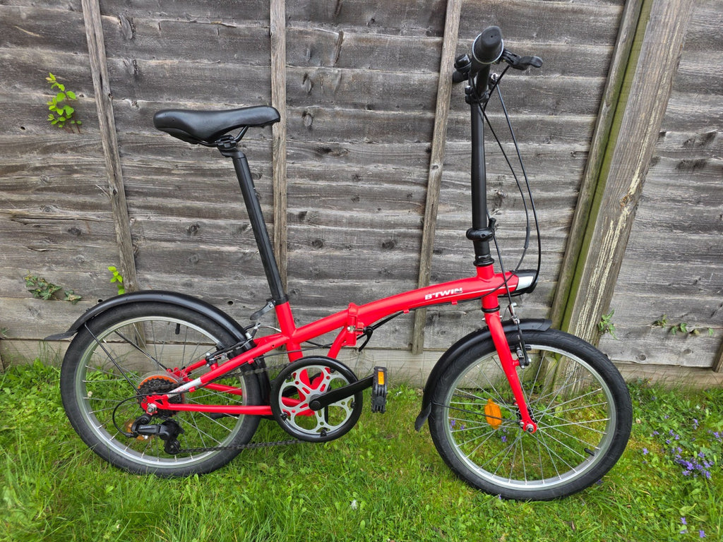Btwin pre-owned folding bike, red, in very good conditions + bonus (sturdy bag)