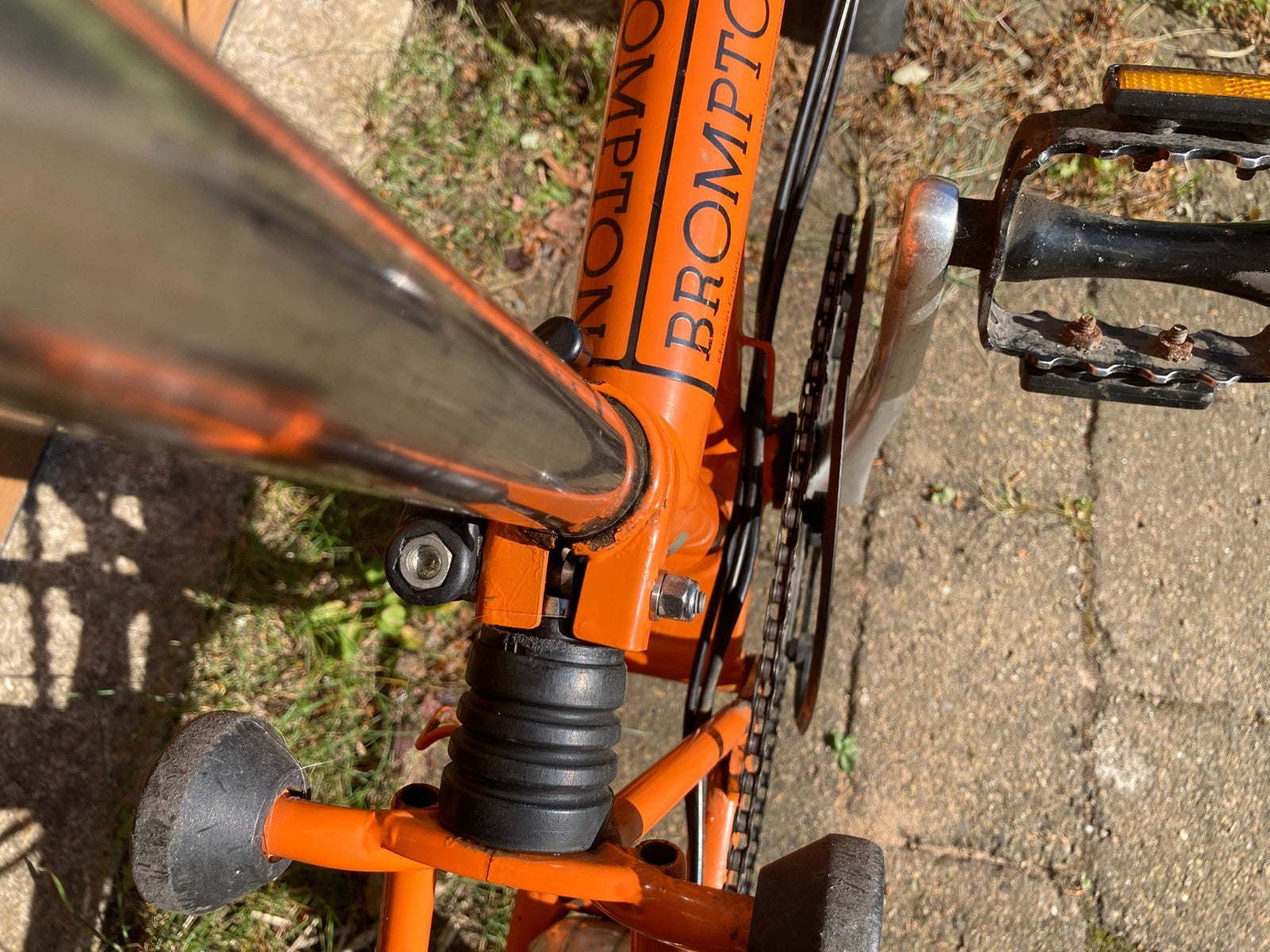 Classic Brompton 6-speed C-line folding bike in orange with long seatpost