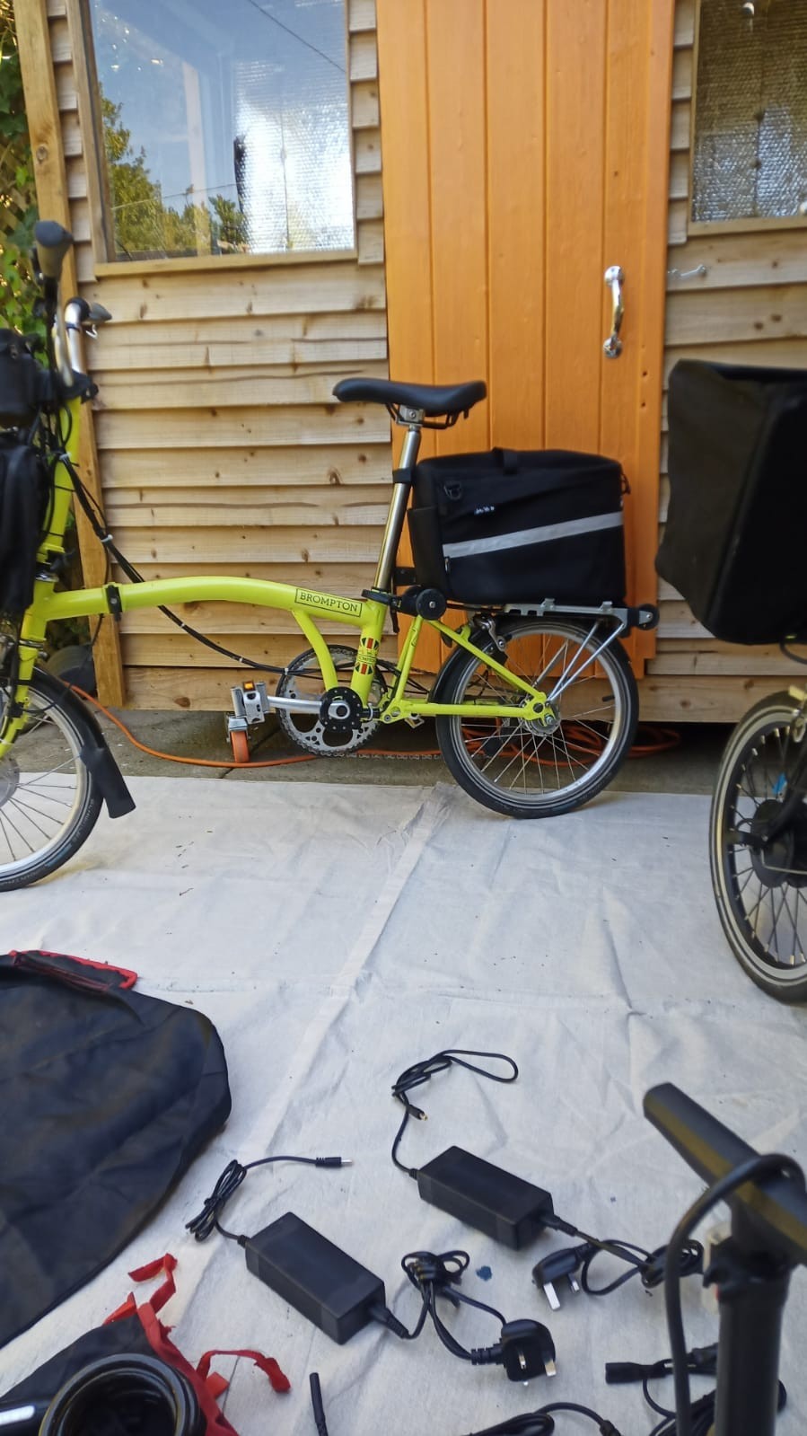 A Pair Of Canary Yellow Bromton Bikes