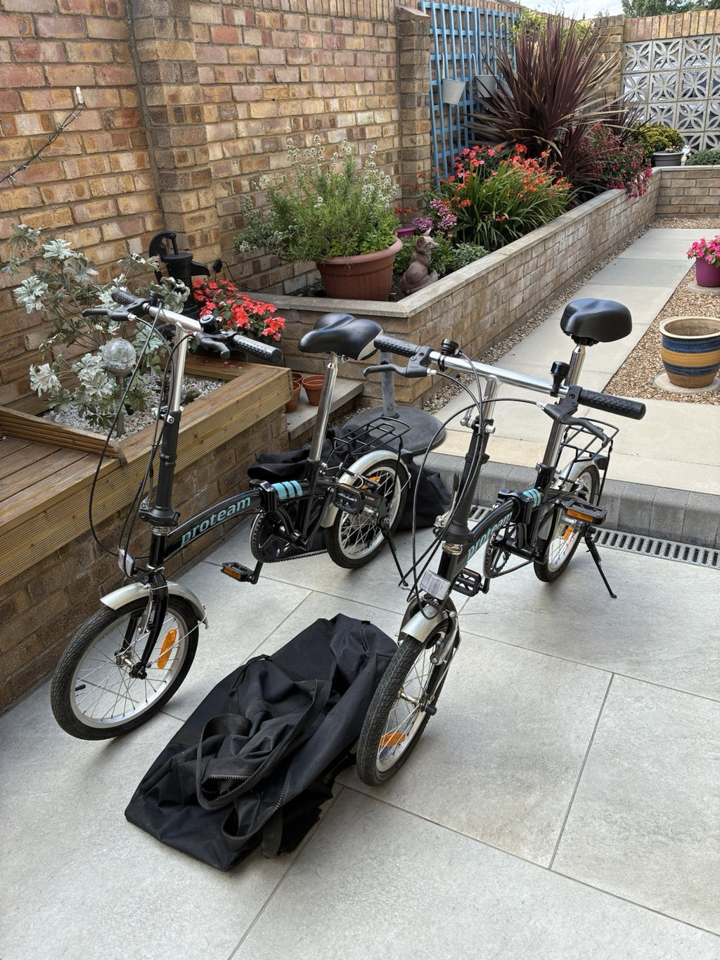 2 Proteam Fold Away Bikes with Carry Cases Excellent Condition Blue 12 Wheels