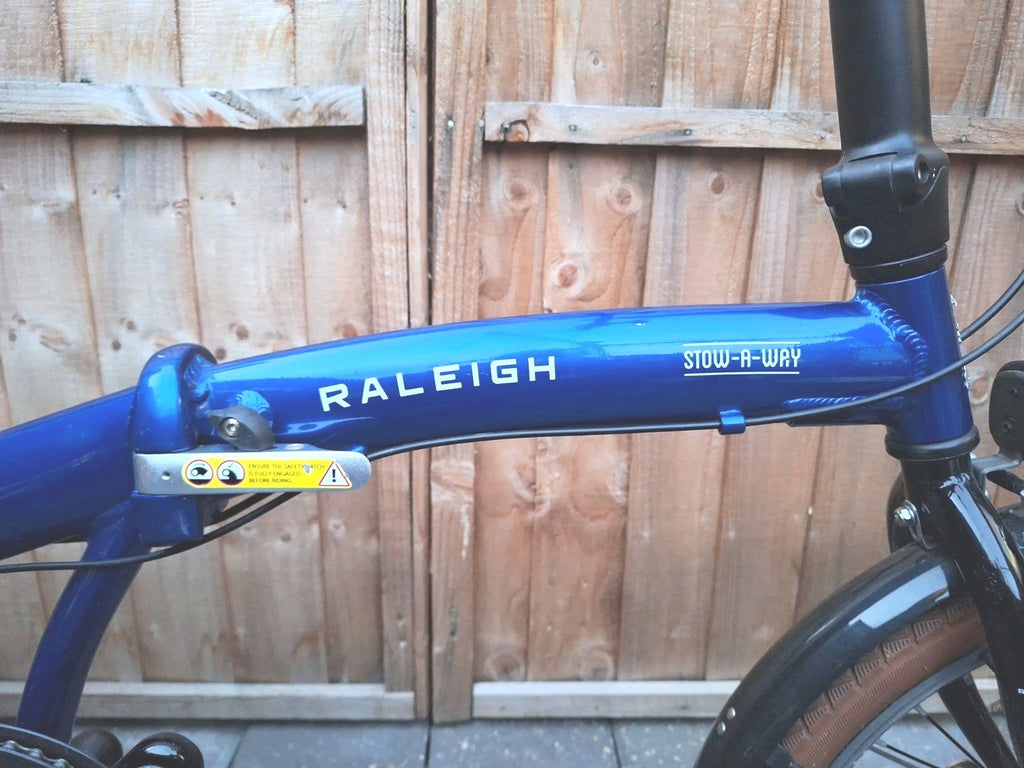 Raleigh Stowaway Folding Bike Unisex 7-Speed Hybrid Bicycle Blue  Mudgaurds Rack