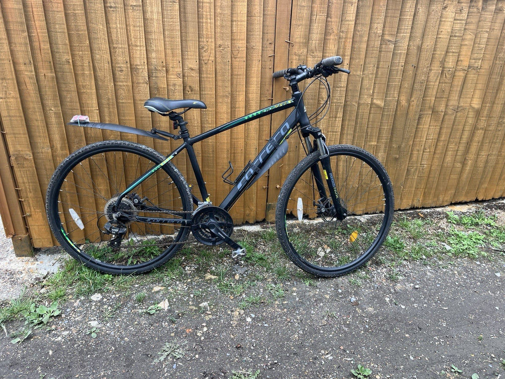 Raleigh Folding Bike White 1 Rack.  Carrera Crossfire 2 and one other bike.