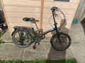 Black coyote folding bike, six speed, v-brakes