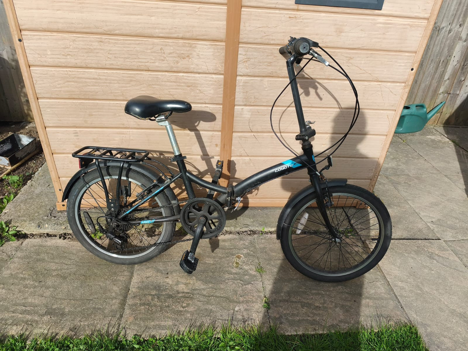 Black coyote folding bike, six speed, v-brakes