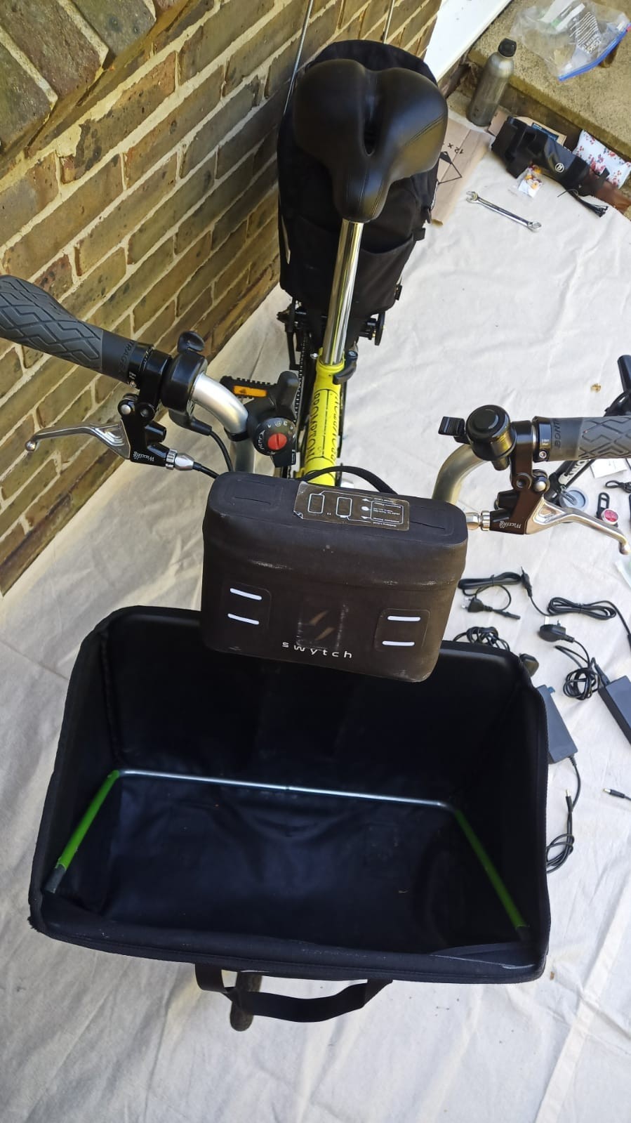A Pair Of Canary Yellow Bromton Bikes