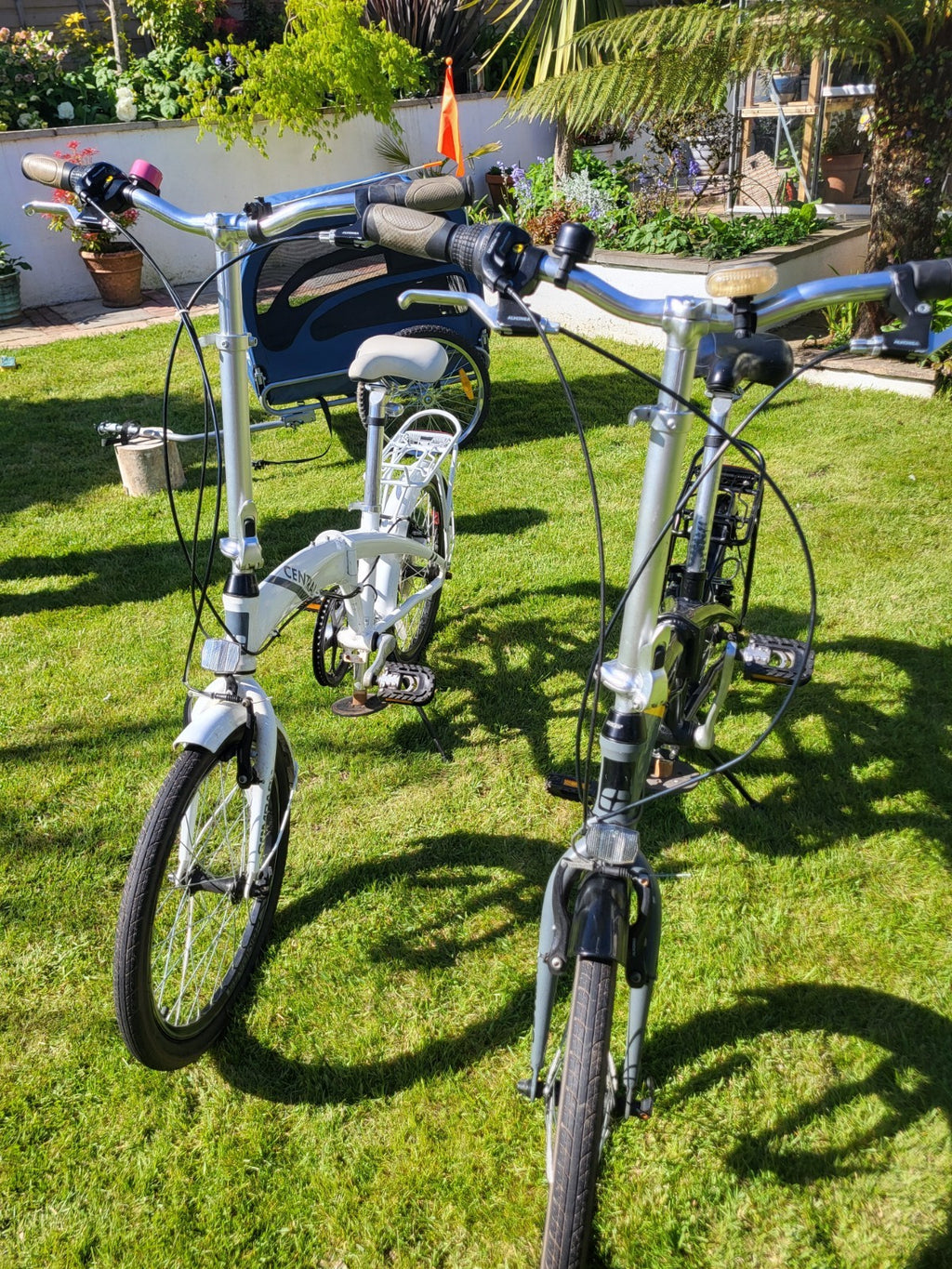 Compass Central  20in Folding Bicycles X  2, one white, one black.