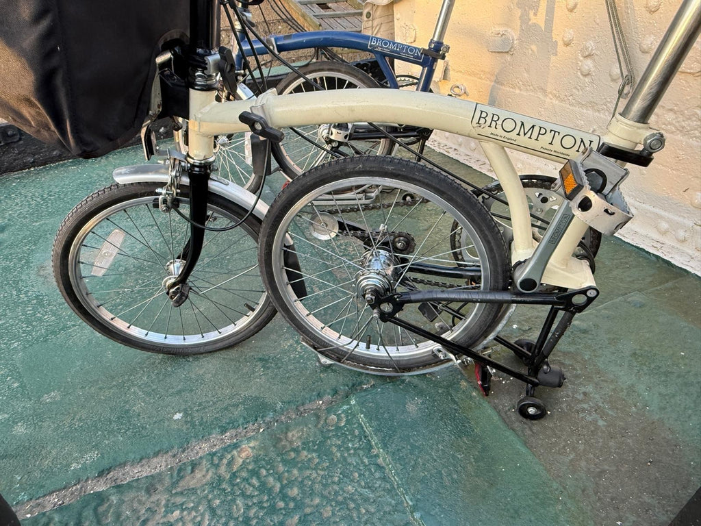 2 Bromptons. 1 x   Navy 6 Speed DYNAMO Light 1 x cream 5 speed.