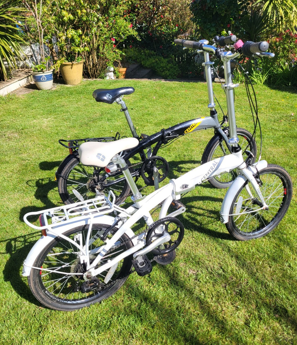 Compass Central  20in Folding Bicycles X  2, one white, one black.