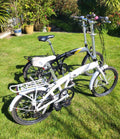 Compass Central  20in Folding Bicycles X  2, one white, one black.