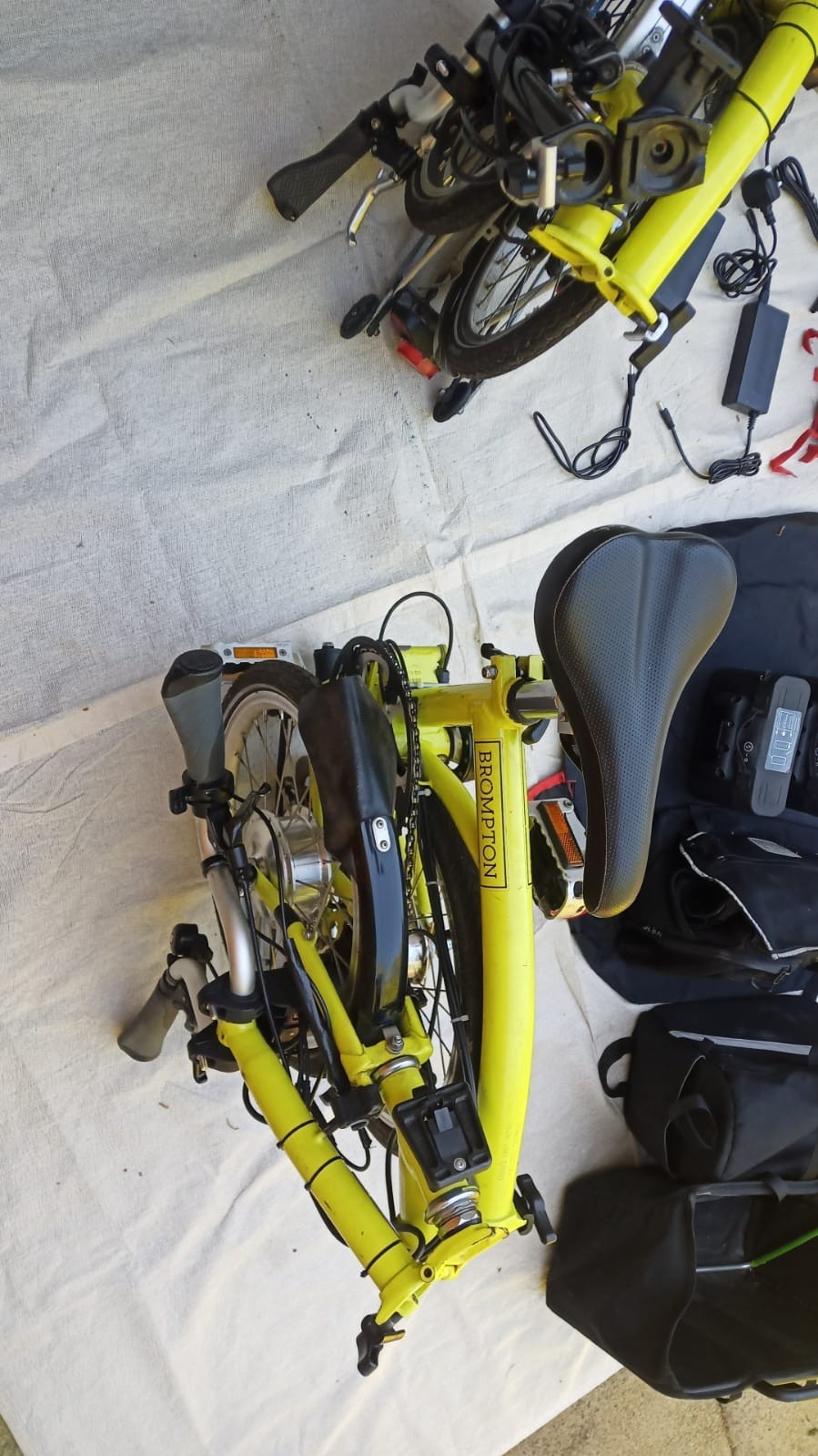 A Pair of Yellow Bromton Bikes with switch conversion. Excellent Condition