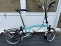 Brompton M3L.  Turkish Green and Black.  With Rear Luggage Rack