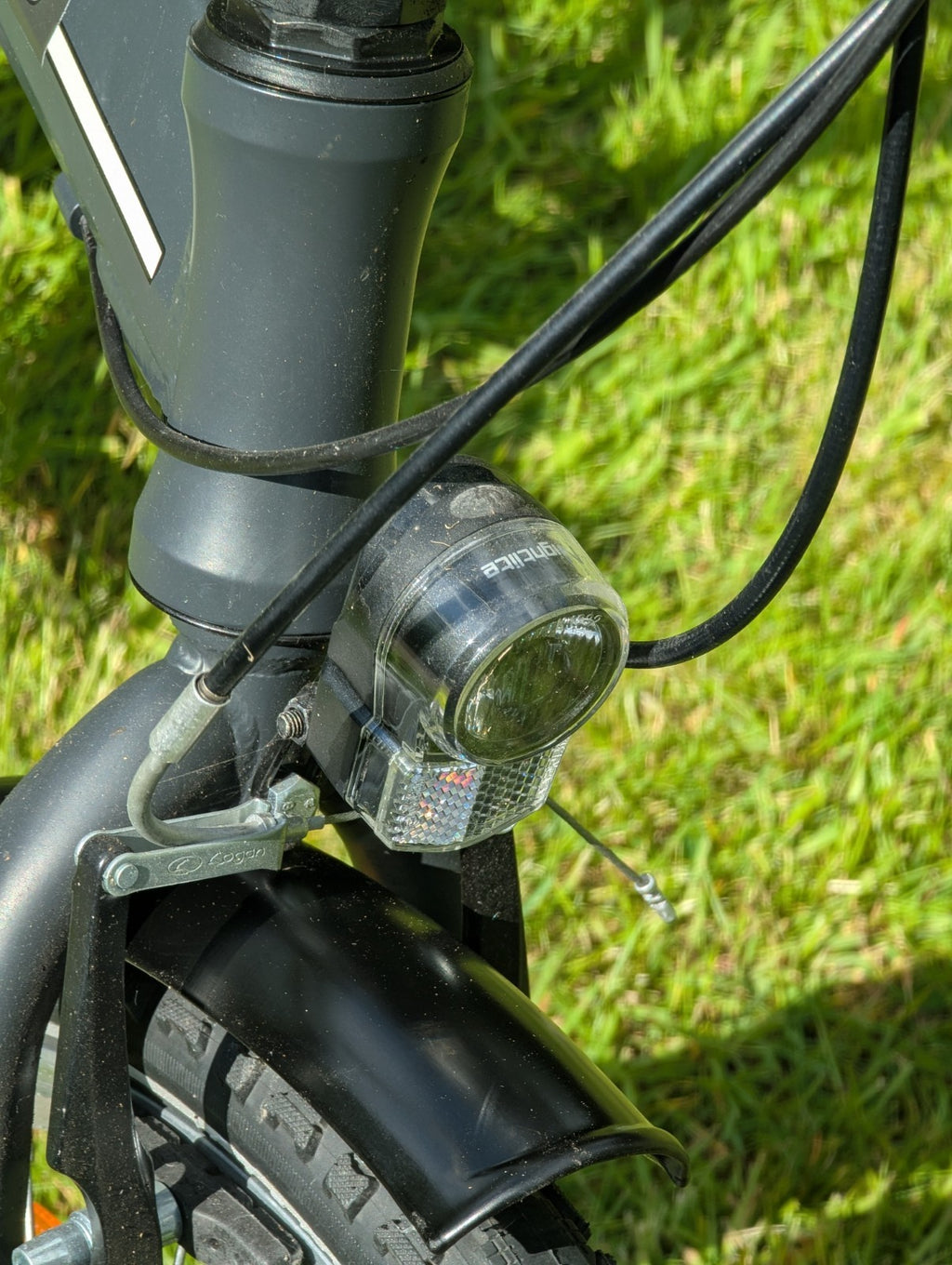 Folding Adult Bicycle with 7 speed Shimano gears, stand, lights, and pannier.