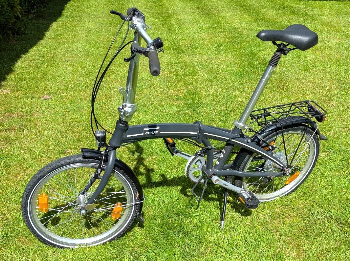 Folding Adult Bicycle with 7 speed Shimano gears, stand, lights, and pannier.