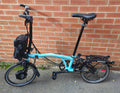 Brompton Electric C-Line, High. 6-speed. Turkish Green. Large and Small bags
