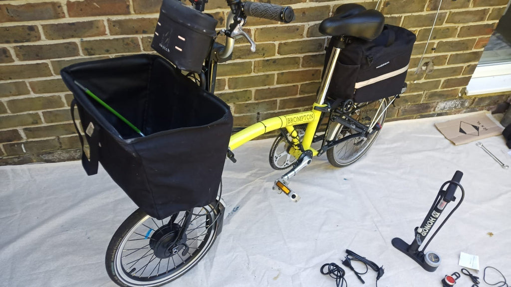 A Pair Of Canary Yellow Bromton Bikes