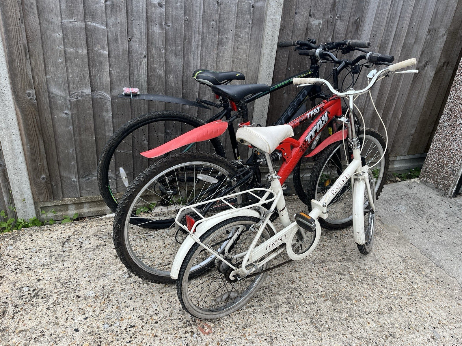 Raleigh Folding Bike White 1 Rack.  Carrera Crossfire 2 and one other bike.