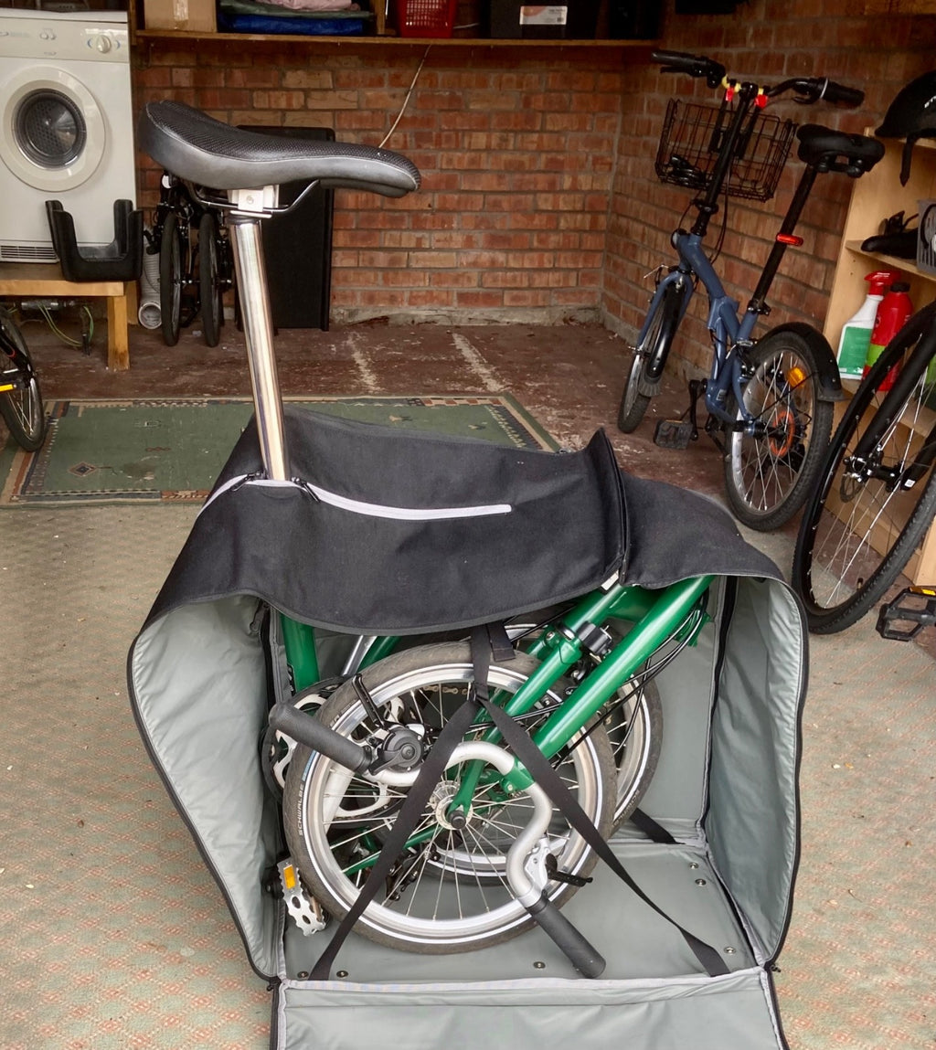 2023 Brompton C line folding bike, 3-speed, green,  with 4-roller transit bag