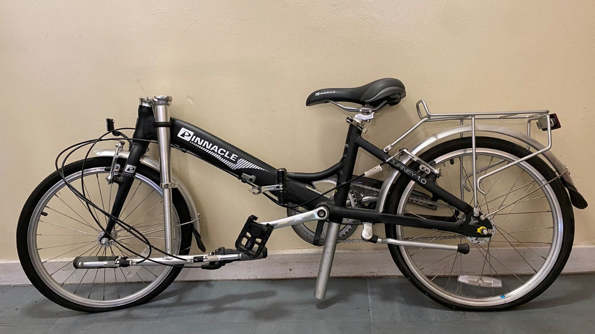 Pinnacle Journey 1.0 folding bike in matte black. Shimano Nexus 3-speed.