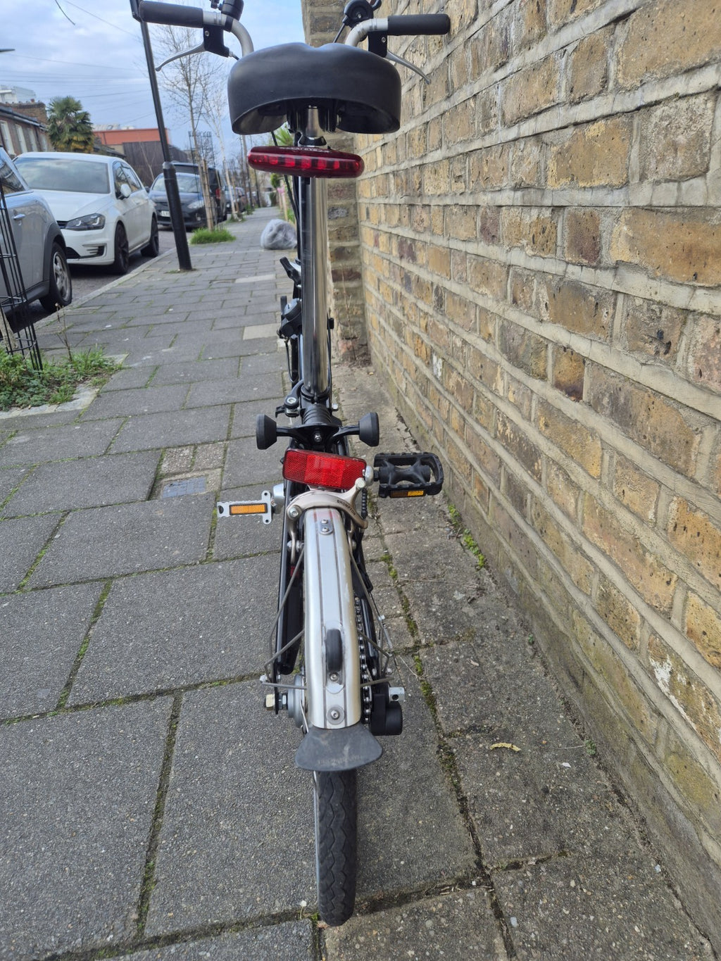 Brompton M3L folding bicycle in Satin Black with front bag.