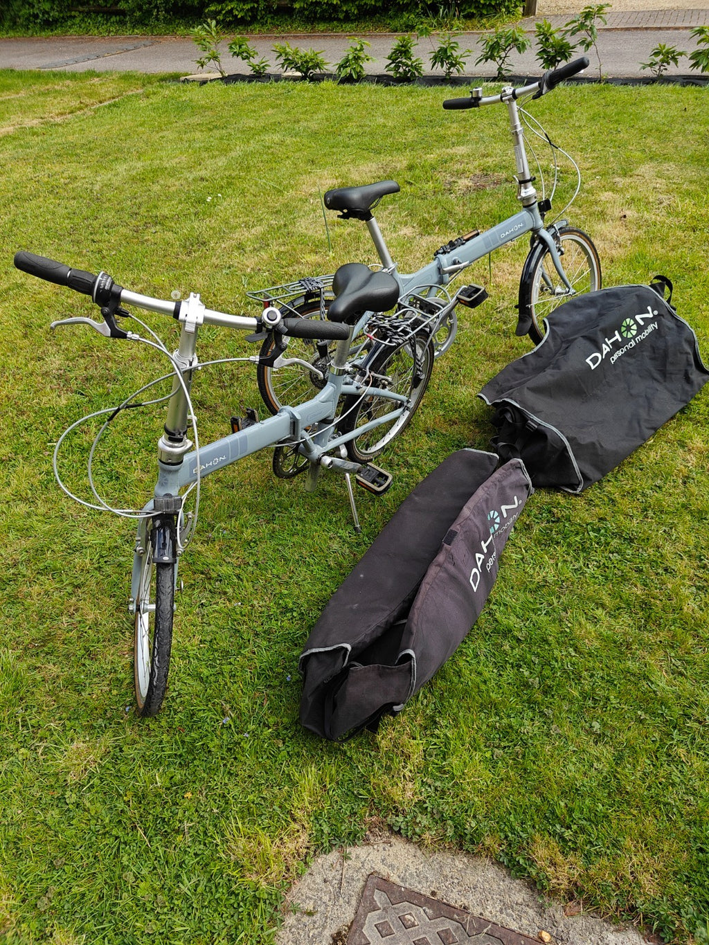 2 x Dahon Vitesse folding bikes, plus 2 x Dahon bike bags.