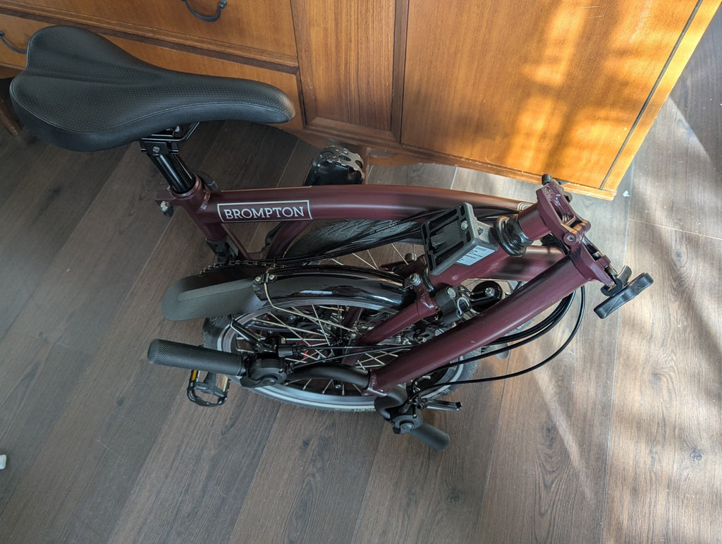 Brompton bike C-line 12-speed 2026 mid bar in Burgundy colour