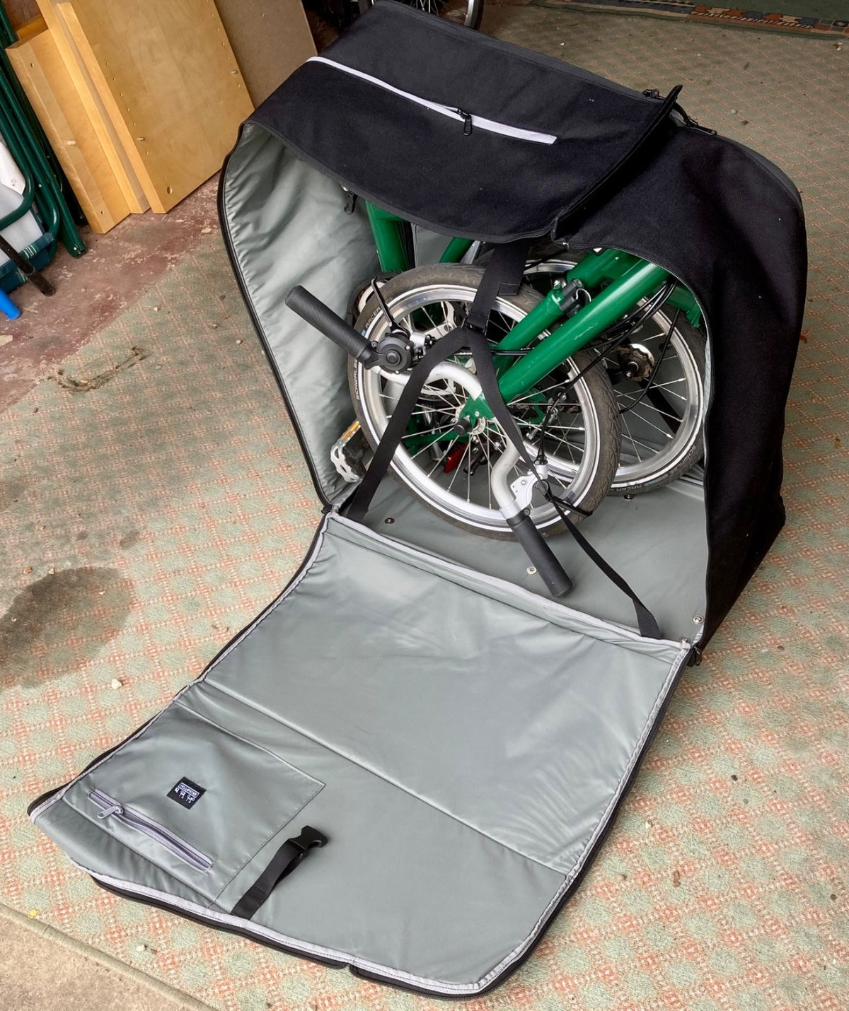 2023 Brompton C line folding bike, 3-speed, green,  with 4-roller transit bag