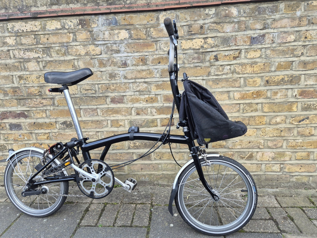 Brompton M3L folding bicycle in Satin Black with front bag.