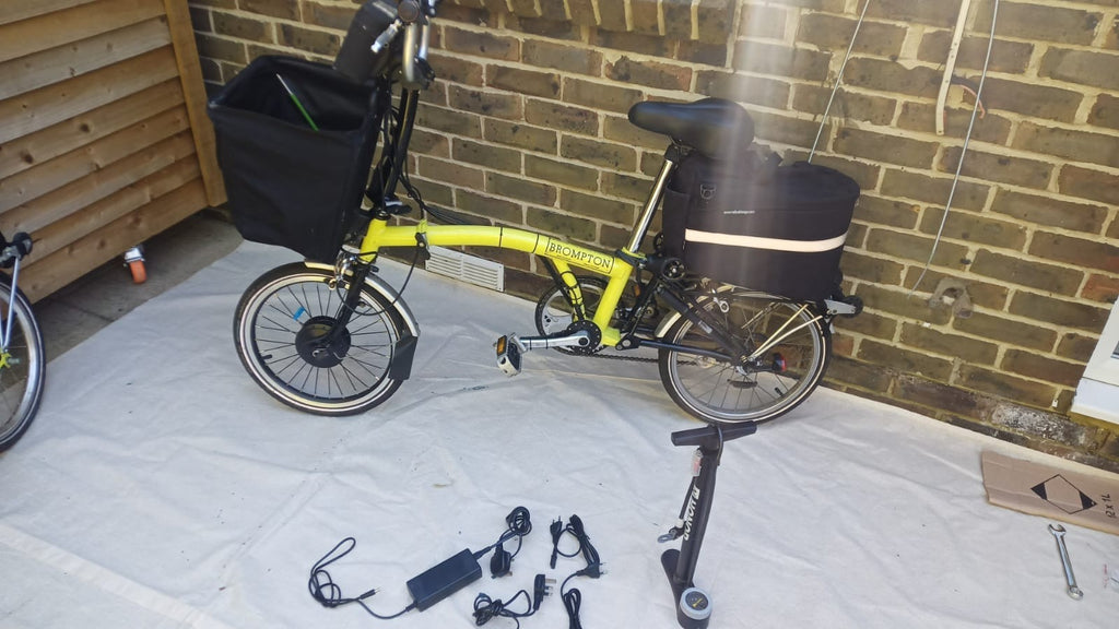 A Pair Of Canary Yellow Bromton Bikes