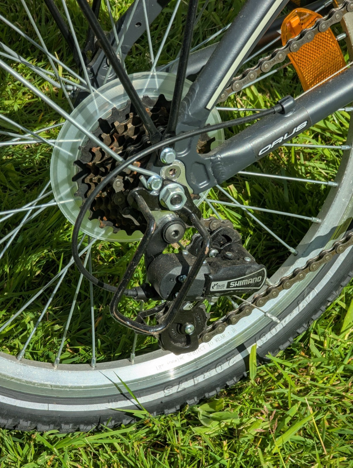Folding Adult Bicycle with 7 speed Shimano gears, stand, lights, and pannier.