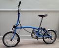Brompton 3 speed folding bike, Brooks saddle, Ortlieb rack bag