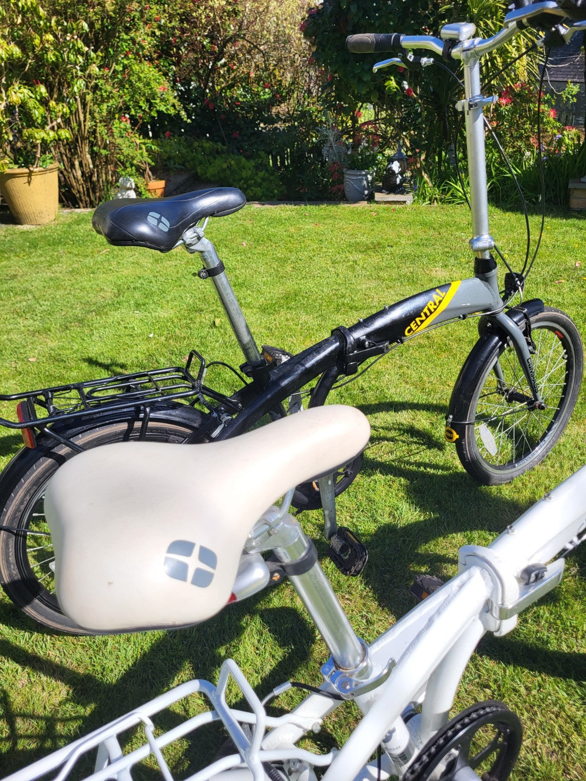 Compass Central  20in Folding Bicycles X  2, one white, one black.