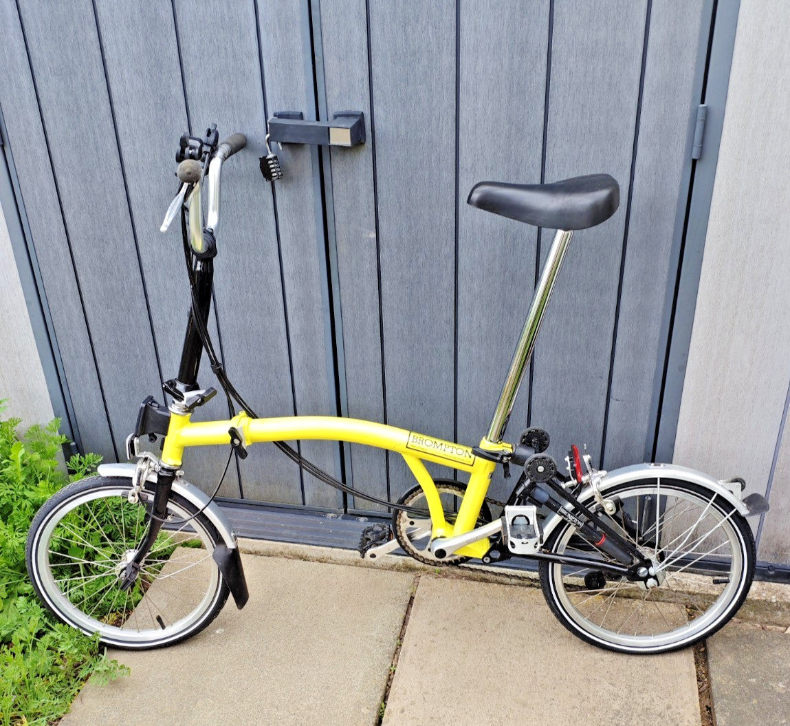 6-Speed Brompton M6L (I think) Folding Bike 2005 Canary Yellow, mudguards.