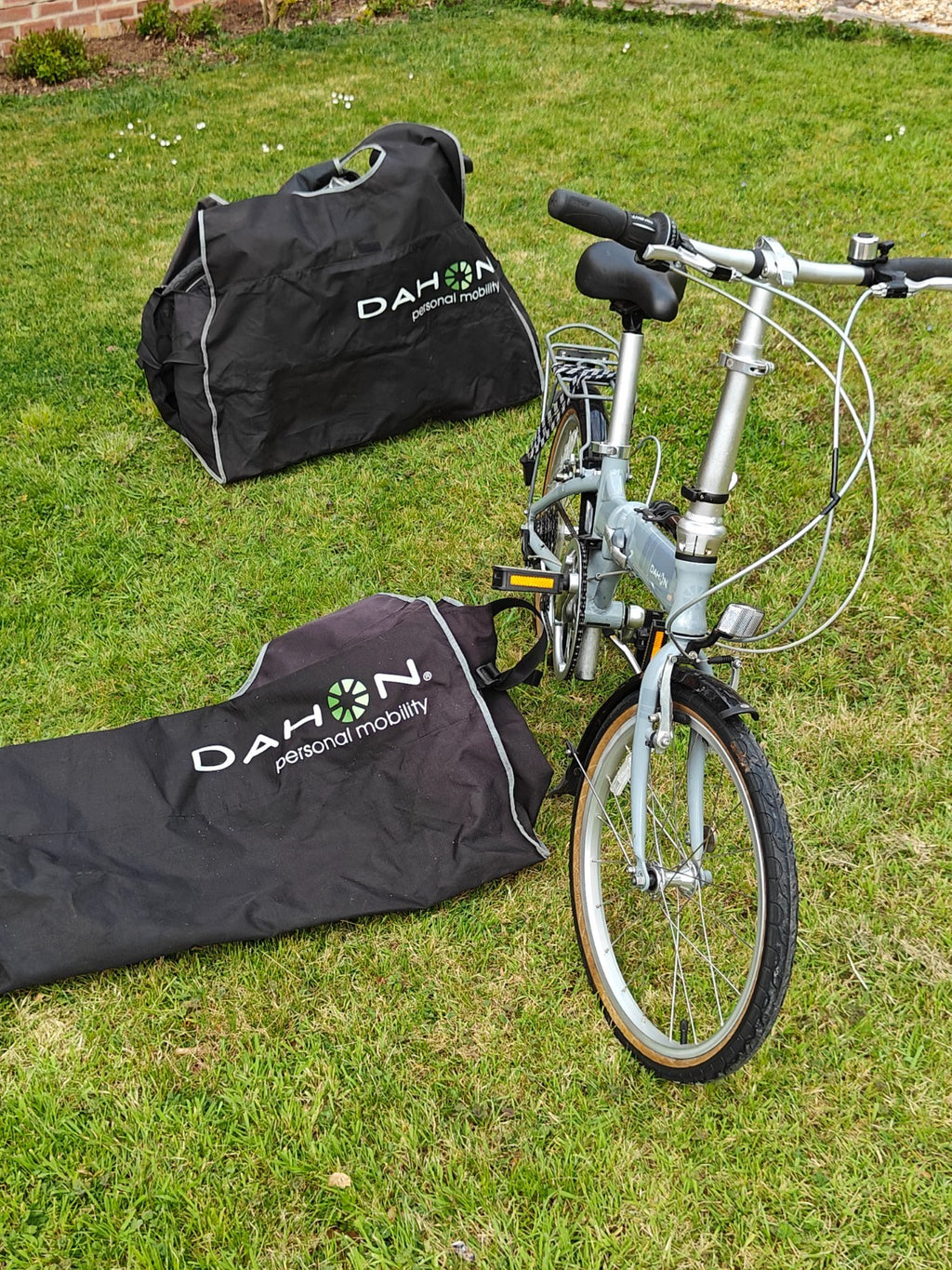 2 x Dahon Vitesse folding bikes, plus 2 x Dahon bike bags.