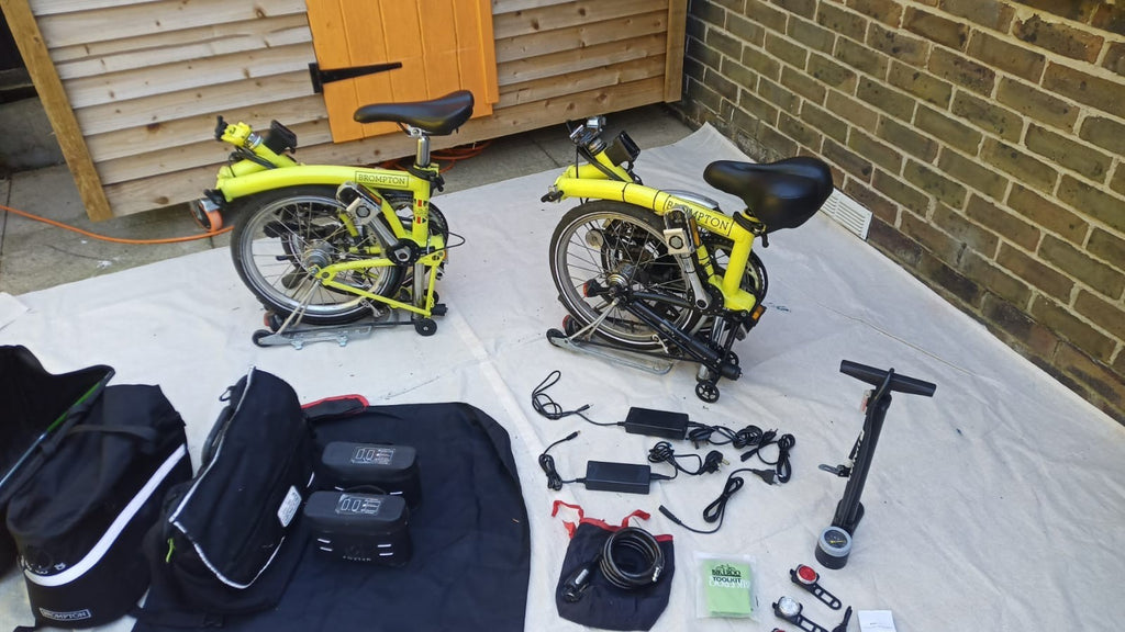 A Pair of Yellow Bromton Bikes In Excellent Condition with Conversion Kit