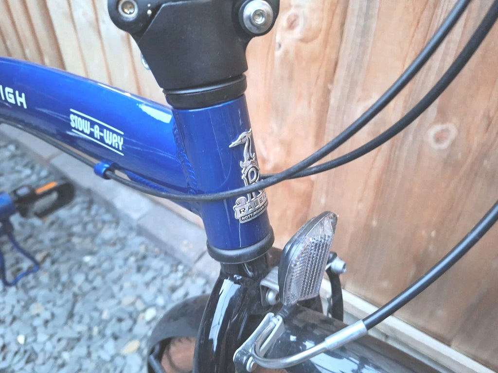 Raleigh Stowaway Folding Bike Unisex 7-Speed Hybrid Bicycle Blue  Mudgaurds Rack