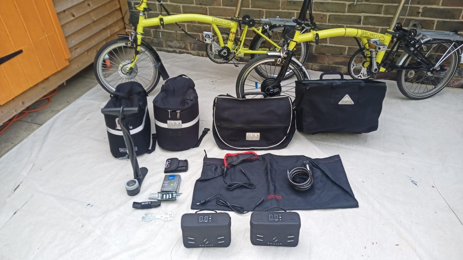 A Pair of Yellow Bromton Bikes In Excellent Condition with Conversion Kit