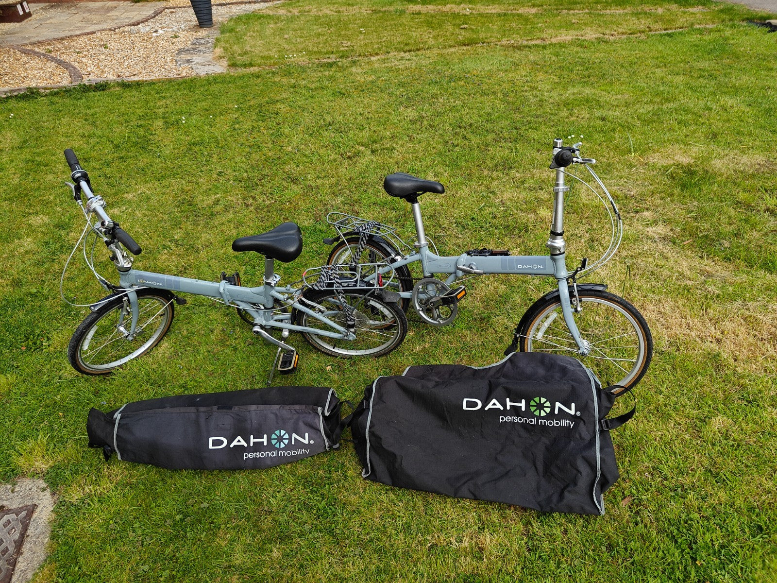 2 x Dahon Vitesse folding bikes, plus 2 x Dahon bike bags.