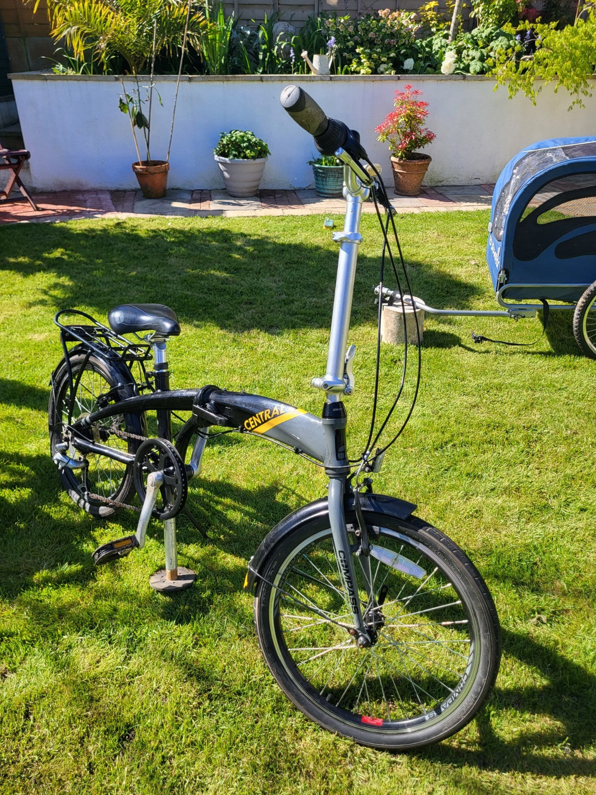 Compass Central  20in Folding Bicycles X  2, one white, one black.