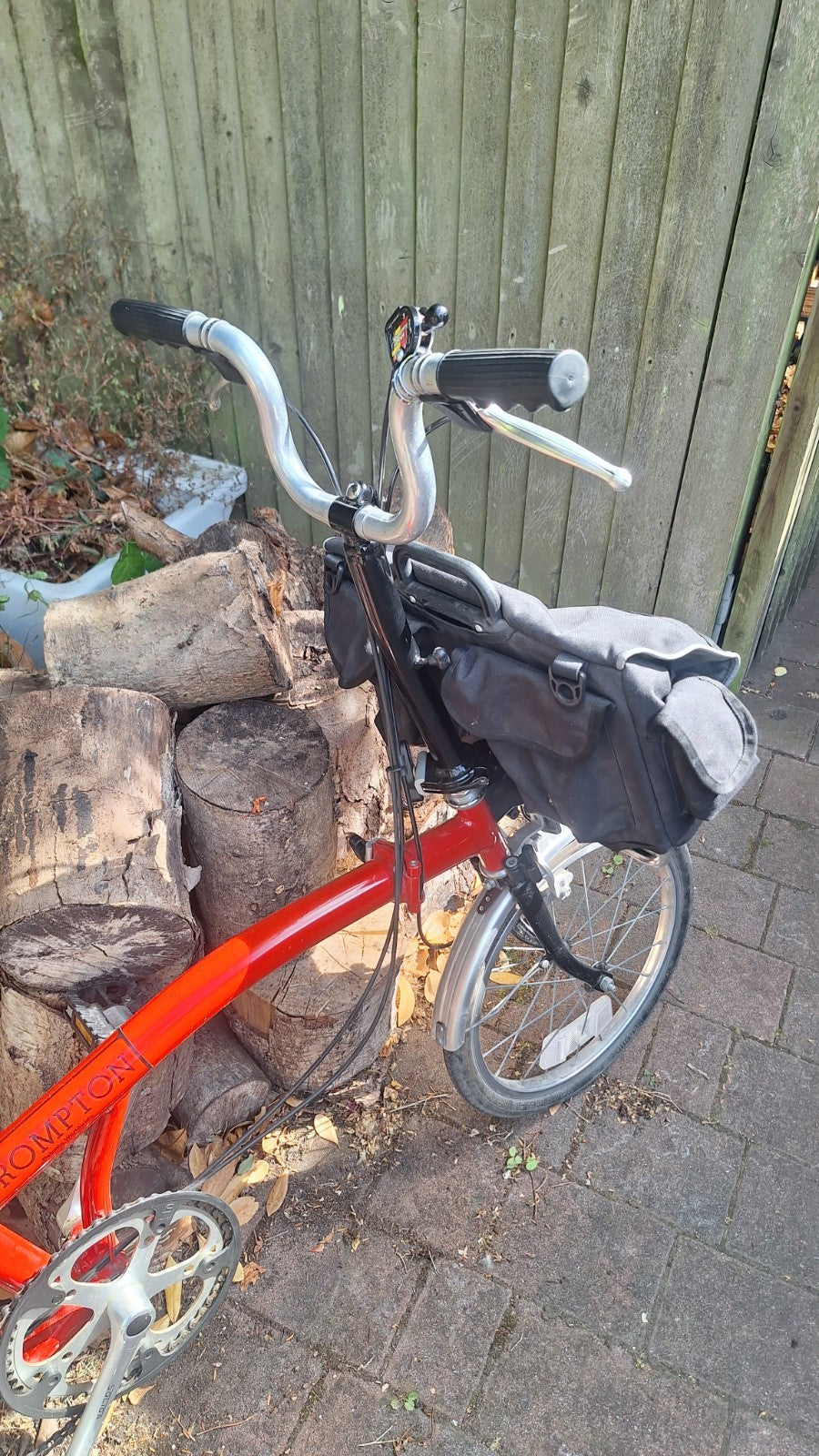 Brompton S3L Folding Bike 3-Speed . With front pannier bag and bike storage bag.