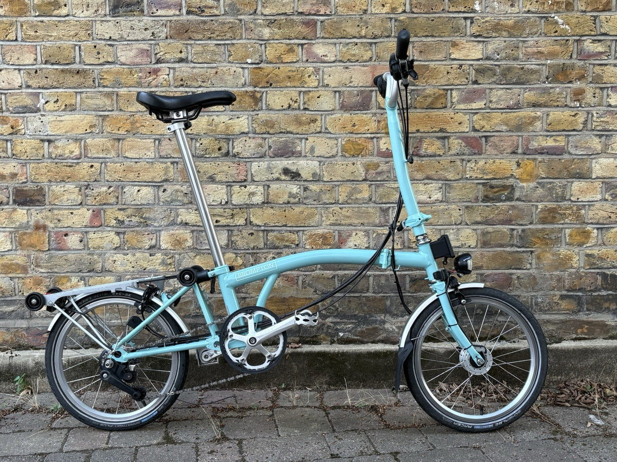 Brompton M6R Folding Bike - Celeste w/ Mudguards, Rack And Dynamo Light Set