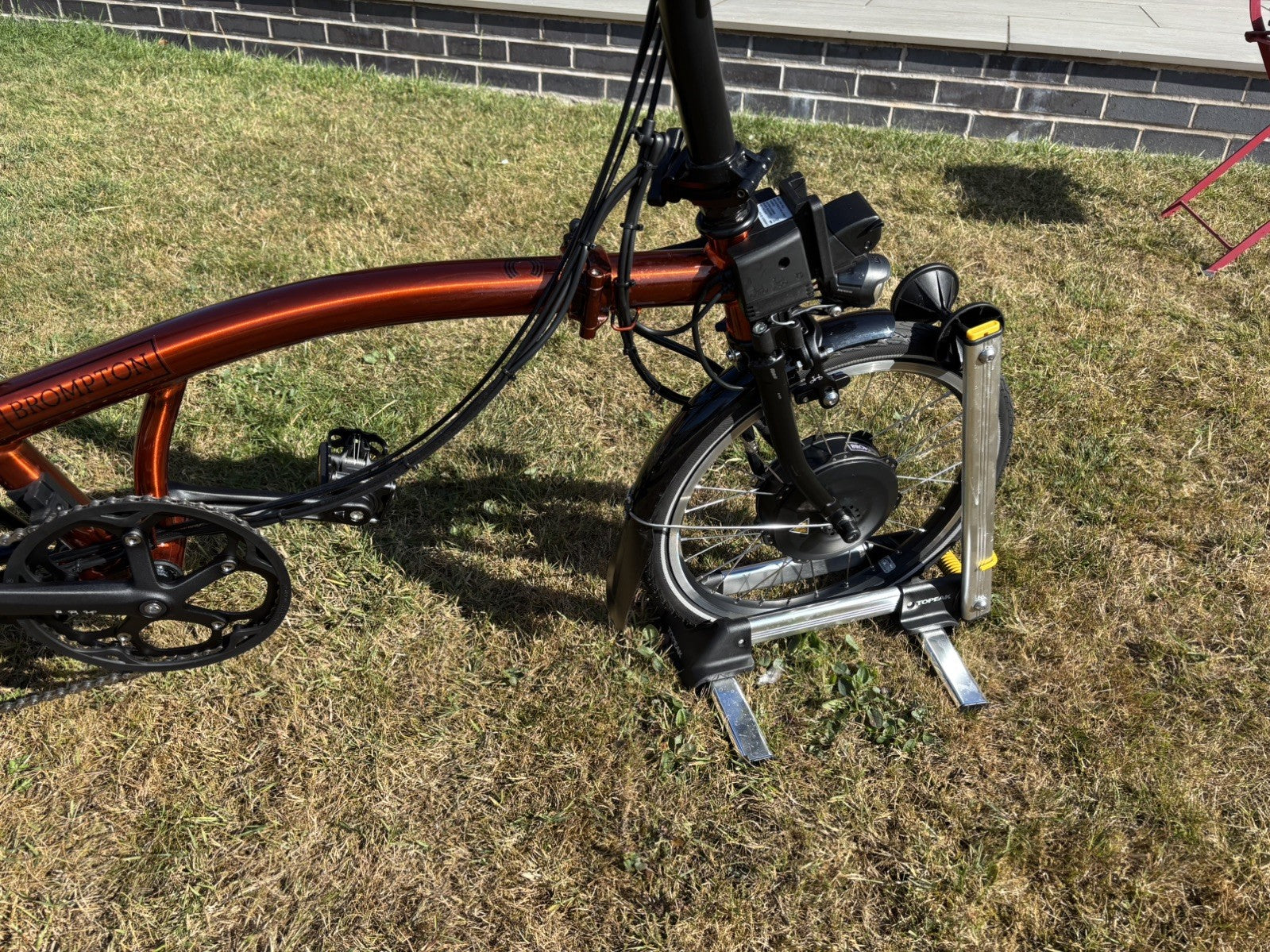 Brompton Electric C Line Explore Mid + Rack - 12 Spd - flame lacquer