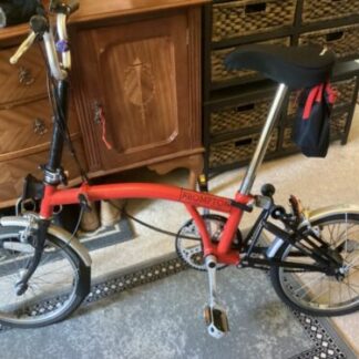 Brompton bicycle in red in excellent condition
